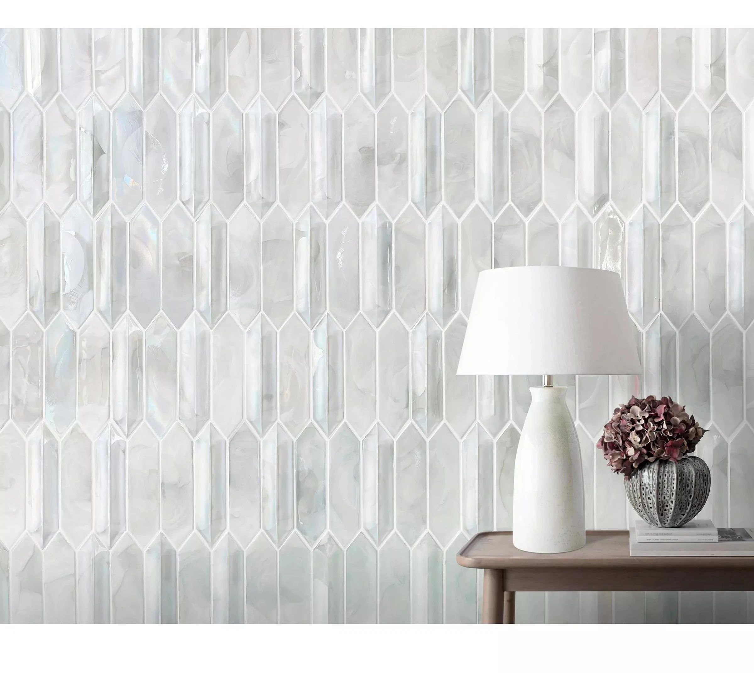 Pearlescent elongated molten glass mosaics installed on an interior wall